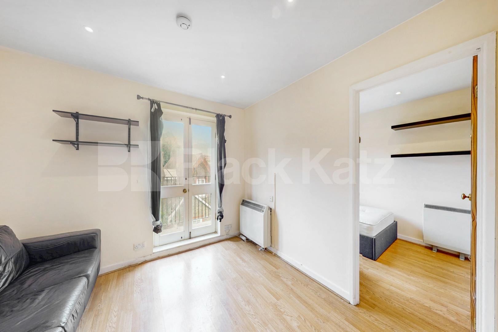 Top floor private development with charming balcony, communal gardens & parking Towergate , Pages Walk 